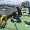 Survey and drain cleaning services for roof drains from a deck of the hotel in Bangkok